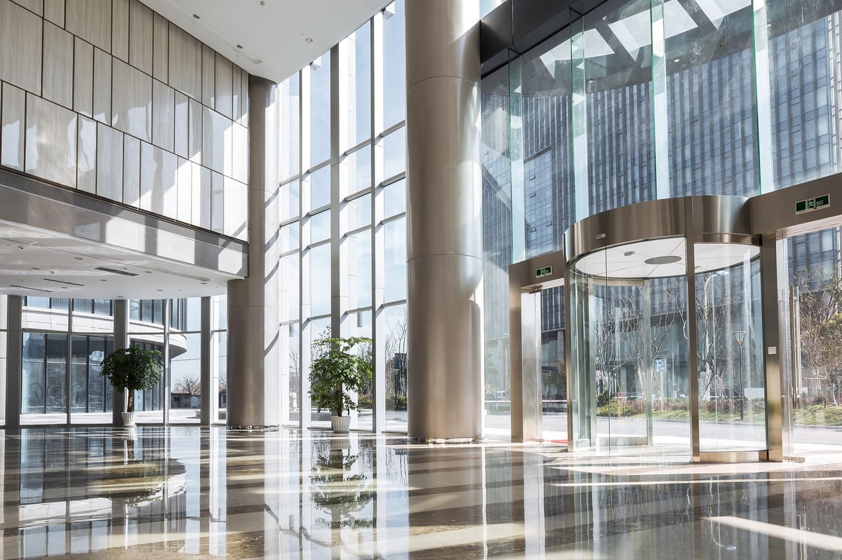 Modern office building lobby with stone floors